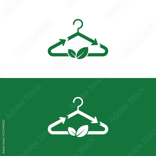 Green clothing hanger with recycling arrows and natural leaves representing sustainable fashion.