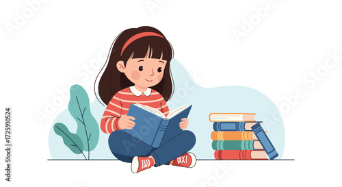 A young girl happily reads an open book surrounded by more books and a leafy plant.
