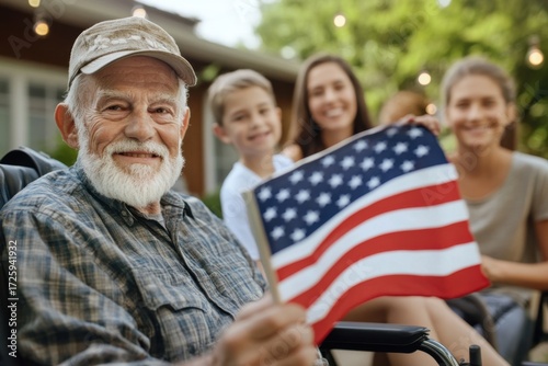 Senior veteran man holding american flag with family