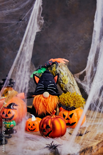 a gnome in a black cat costume dancing at a noisy pumpkin Halloween spider web party in a dark forest, All Saints Day, vertical, creative focus