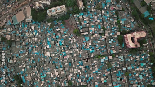 Wallpaper Mural Aerial view of densely packed slum dwellings with blue tarps in mumbai, india Torontodigital.ca