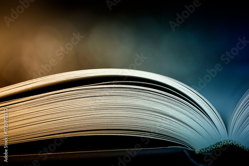 open book on dark colorful background