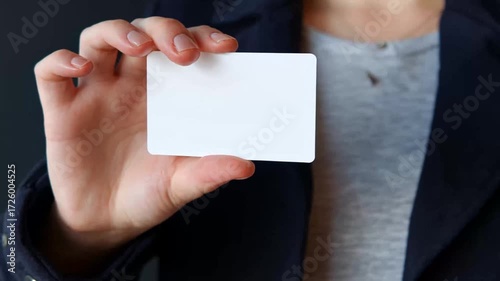 Person holding blank business card