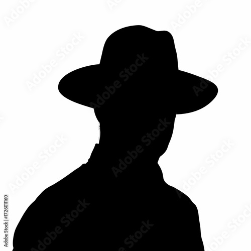 Dramatic Low-Angle Silhouette of a Man Against a Light Background