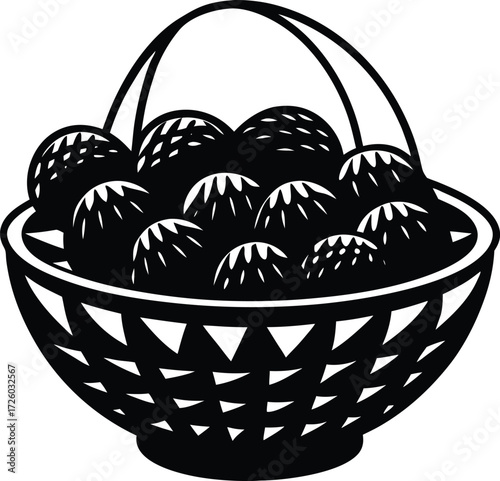 A woven basket filled with dark round fruits possibly plums or cherries