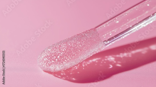Close-up of a shimmering lip applicator.