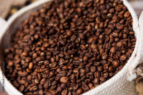 toasted coffee beans in a white nest