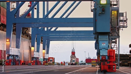 Wallpaper Mural Cargo containers are being loaded onto a ship at the port terminal Torontodigital.ca