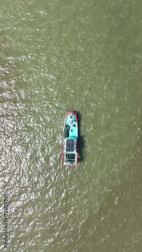 Aerial View of Tugboat Transporting Cargo on the Waterway River