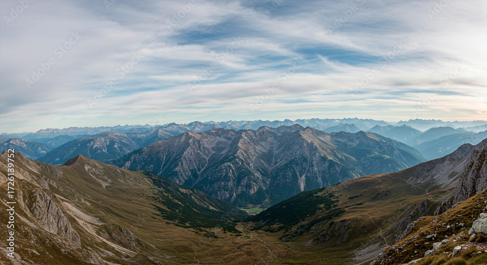 Fototapeta premium Panoramic View of the Alps Mountains and Deep Valley