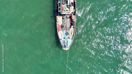 Aerial View of Fishing Boat Floating in the Sparkling Water