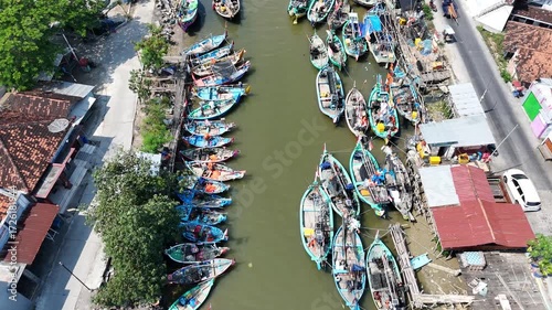 Aerial View of Fishing Boats Docked Along River
