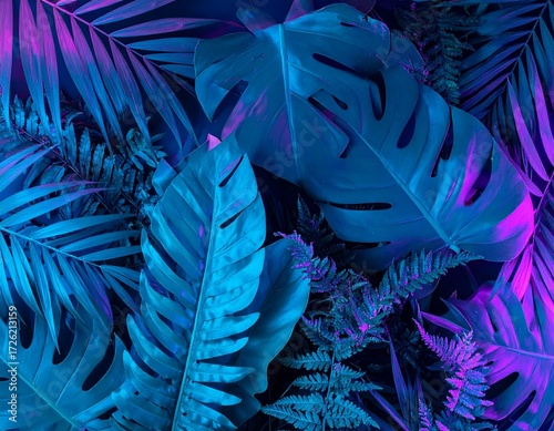 A lush arrangement of tropical jungle leaves, including monstera and fern, glowing under dramatic blue and purple neon lighting.