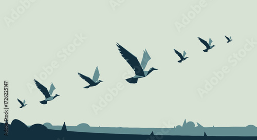 Flock of birds flying in formation across the sky.