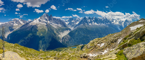 Mountain landscape of the Alps in Chamonix valley, France high resolution wide angle panoramic landscape. Alpine scenery in summer sunny weather on Tour du Mont Blanc, TMB trekking route