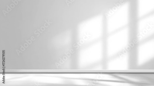Dynamic window light and shadow effects moving across a clean white wall interior
