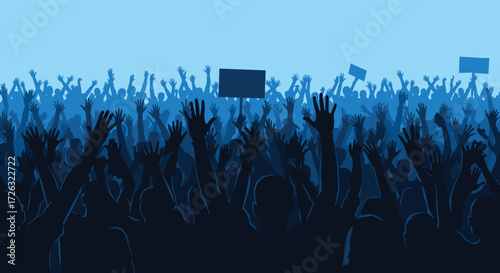 A large silhouette crowd of people with their hands raised high in the air in protest and demonstration.