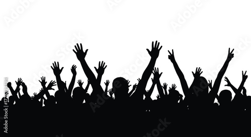 A crowd of people with their hands raised up in the air celebrating together and enjoying a lively event.