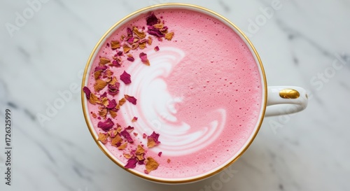 Pink rose latte in white cup on marble surface