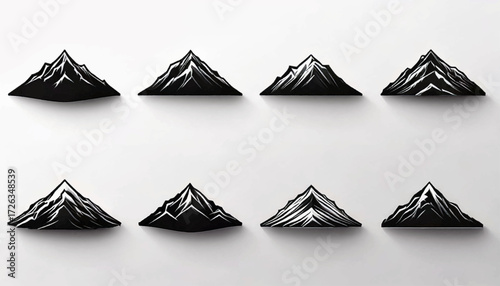 A collection of eight stylized black and white mountain peak icons with shadows on a light background.