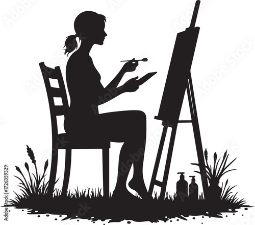 Silhouette of woman painting outdoors on easel with grass and bottles