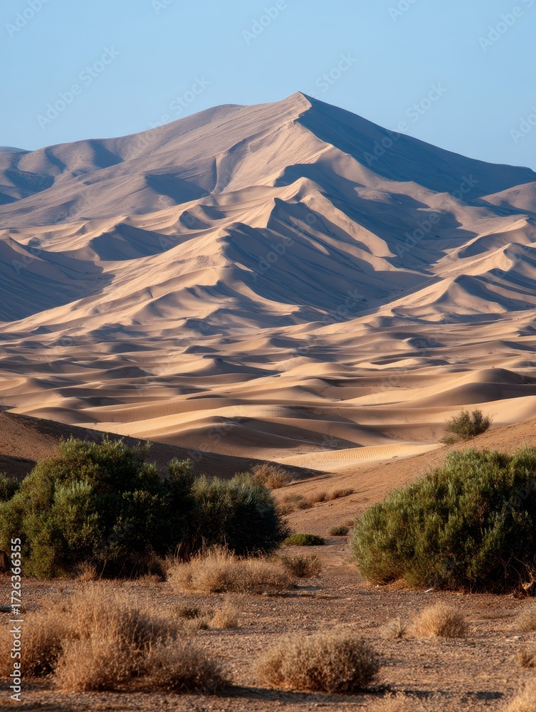Naklejka premium Majestic Tan Mountain Range in a Desert at Sunrise