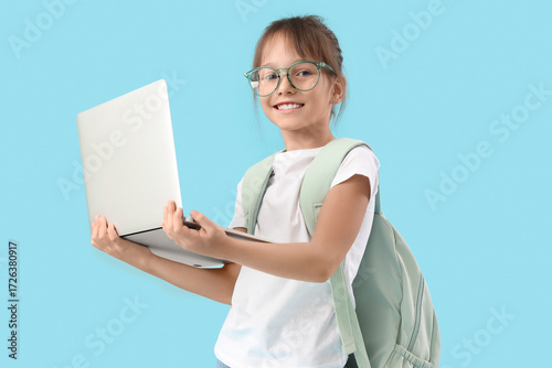 Cute schoolgirl with modern...