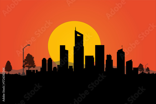 City Silhouette at Sunset: The captivating outline of a modern city against the dramatic backdrop of a fiery sunset, representing urban life and the beauty of dusk.
