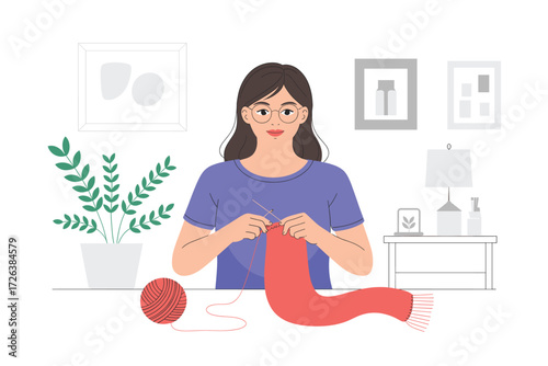 Young Woman Knitting a Scarf at Home: A Cozy and Creative Hobby in a Minimalist Interior with Abstract Art