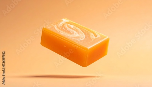 A orange soap bar floating isolated on a orange background