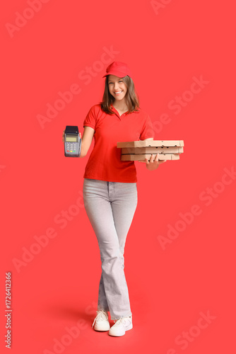 Female courier with pizza b...