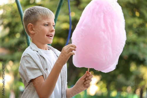 Teen boy with cotton candy ...