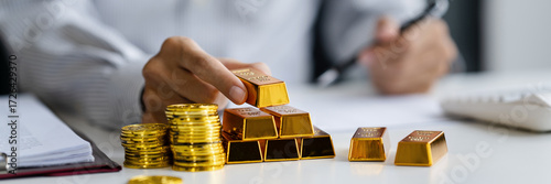 businessman investor holding gold as traditional safe haven asset in volatile economic conditions