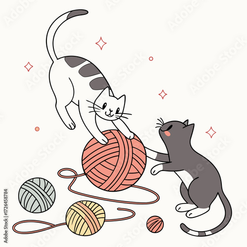 cats are playing with ball