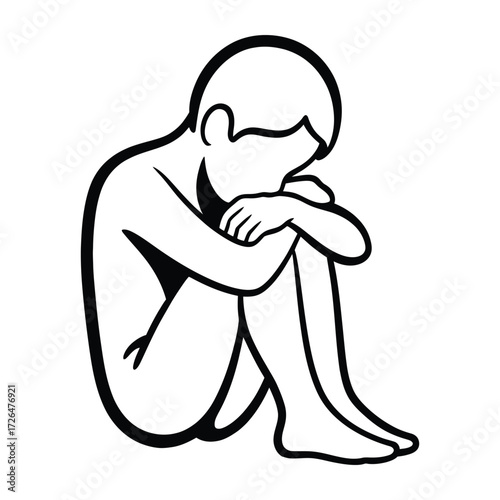 Sad child sitting alone curled up in a ball feeling lonely and depressed