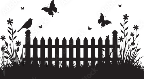 Black silhouette of bird butterflies and flowers by picket fence