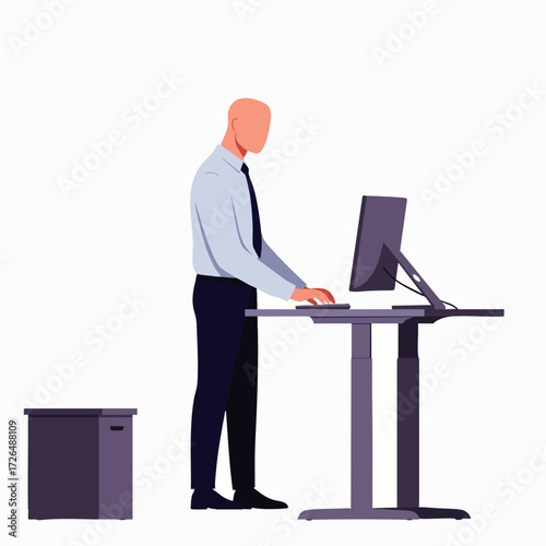 A focused professional man stands at an ergonomic adjustable desk, working on his computer to enhance productivity and promote a healthier, dynamic office life.