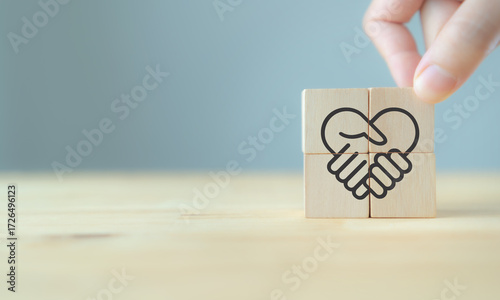 Empathy in leadership concept. Wooden block symbolizing trust, empathy and partnership representing individuals, emotional intelligence and trust in workplace leadership and team collaboration.