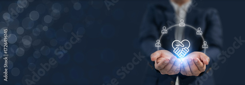 Empathy in leadership concept. Holding a glowing icon of  trust, representing empathy, emotional intelligence and trust in workplace leadership and team collaboration.