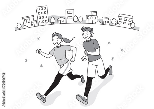 街なかをランニングする笑顔の男女