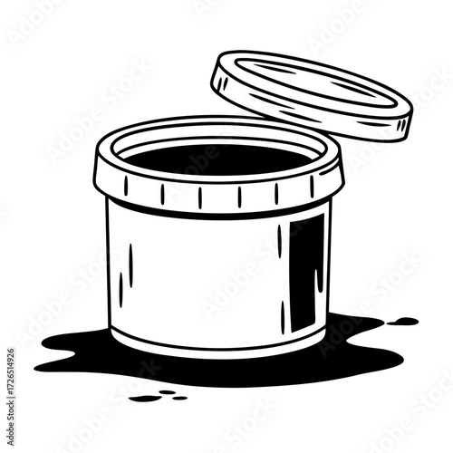 Black glue pot with lid open and spilled contents on white background  