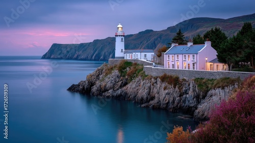 Coastal Lighthouse Landscape at Dusk with Rocky Cliffs and Calm Blue Water