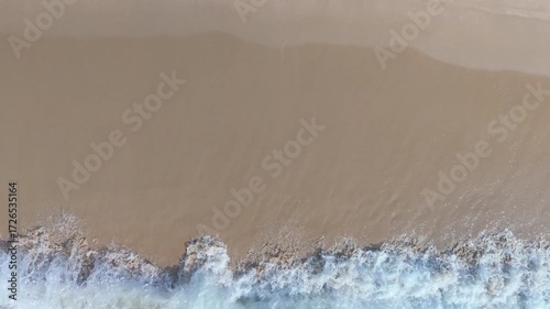 Summer seascape beautiful waves, blue sea water in sunny day. Royalty high-quality free best stock of tranquil beach with turquoise waves splashing, sand shore. Aerial view, tropical nature background