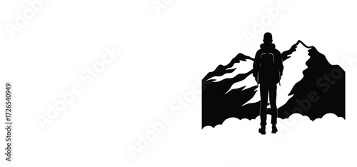 Hiker silhouette against mountain peaks backpack