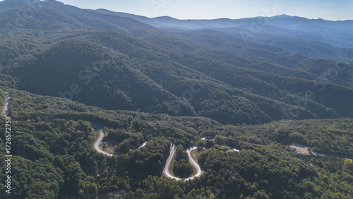 Aerial view of winding asphalt mountain road among green trees in summer. (Domaniç,İnegöl dağ yolu)	