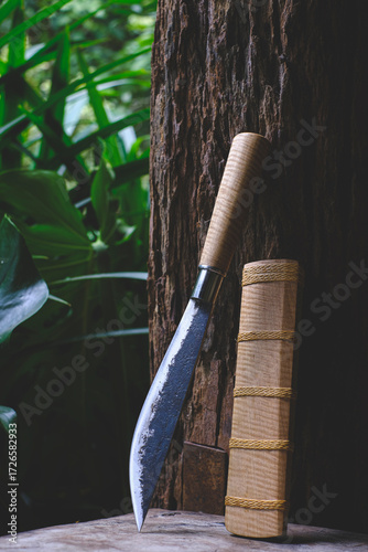 Enep knife of a Thai native. Sheaths made of tiger pattern wood