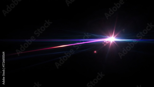 Bright lens flare streaks across a black background