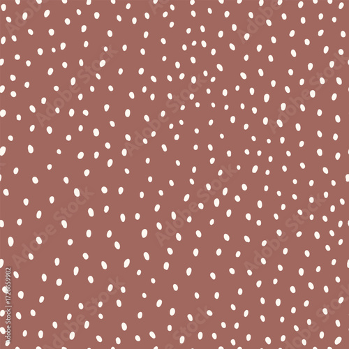 Seamless pattern with white polka dots different sizes, hand drawn dots on brown background.