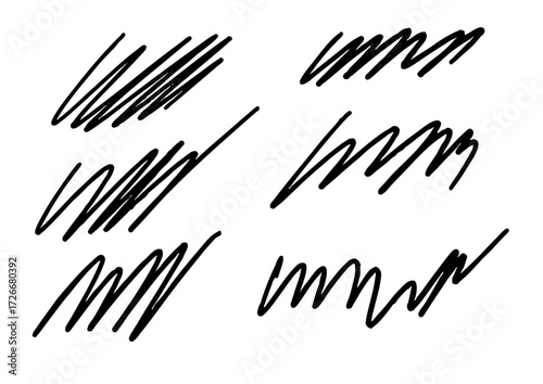 Collection of black scribbles and rough hand-drawn marks, isolated on a white background, representing abstract doodles and sketchy elements