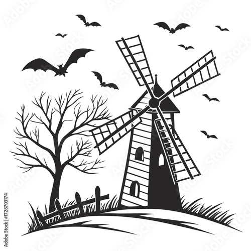 Spooky old windmill with tattered sails on a desolate landscape under a dark sky
